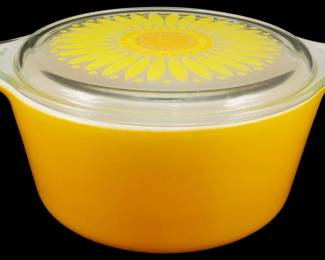 1161 - Pyrex Sunflower 1.5 Quart Casserole w/ Lid (Description): Vintage Pyrex Sunflower pattern 1 1/2 quart  casserole dish with original clear glass lid.  The casserole features a vibrant golden  yellow base with tab handles, while the lid  displays the iconic Sunflower pattern with radiating yellow petals and an orange center.  Measures 4 inches tall by 10 inches wide by  7.5 inches deep.