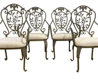 7631 - Set of 4 Decorative Metal Patio Chairs (Description): Featuring ornate scrollwork and decorative  leaf motifs on the shield-shaped backs. The  chairs have gracefully curved arms and  cabriole-style legs with a weathered green  patina finish. Each chair is fitted with a upholstered seat cushion. Measures 40 inches  high by 24 inches wide by 19 inches deep.