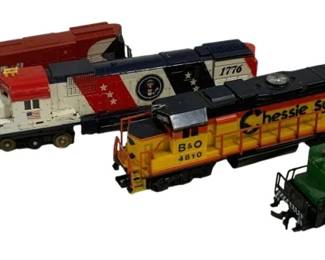 1593 - 4pc Lot HO Scale Locomotive Engines (Description): A lot of four HO scale locomotive engines.  The collection includes a CP Rail 4500 in red  and white, a patriotic 1776 Bicentennial  locomotive in red, white and blue with  Presidential seal, a Chessie System B&O 4810 in yellow and blue, and a Southern 2003  switcher in green. All are diesel-style  locomotives suitable for model railroad  layouts.