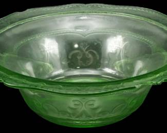 887 - Federal Glass Patrician Uranium Berry Bowl (Description): Vintage Federal Glass Patrician pattern  uranium glass berry bowl. This Depression-era  piece features the characteristic scalloped  rim and pressed scrollwork design typical of  the Patrician pattern. The translucent green uranium glass displays the distinctive glow  associated with this collectible glass type.  Measures 3 inches tall by 9 inches in  diameter.