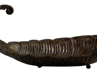 1536 - Bronze Centerpiece Bowl 23.5"x13"x13" (Description): Bronze centerpiece bowl featuring an elegant  cornucopia or horn of plenty design with  ribbed detailing throughout the body. The  piece has a gracefully curled decorative  handle at one end and rests on small ball feet. The bowl displays a rich, dark patina  characteristic of aged bronze. Measures 23.5"  x 13" x 13".