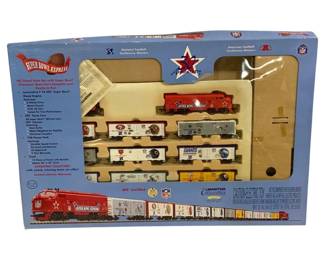 1689 - Mantua Super Bowl Express HO Train Set (Description): Mantua Super Bowl Express Train Set, an NFL  Certified collectible commemorating the 30th  Anniversary of the Super Bowl. This HO scale  diesel train set features a Locomotive F-7A  NFL Super Bowl diesel engine and NFL team cars representing Super Bowl Champion teams  from both the National Football Conference  and American Football Conference. The  complete ready-to-run set includes track and  power pack. Produced by Mantua Collectibles,