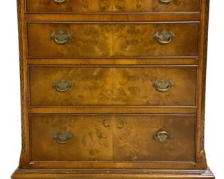 7742 - Burled Walnut 4 Drawer Chest 32"x25"x18" (Description): A handsome four drawer chest featuring  beautifully figured burled walnut veneers on  the drawer fronts. The piece showcases  Georgian-style design elements including  carved corner columns with rope twist detailing, brass bail pull hardware, and  bracket feet. The warm honey-toned finish  highlights the distinctive burl wood grain  pattern. Measures 32 inches tall by 25 inches  wide by 18 inches deep.