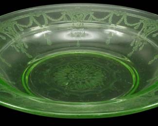 896 - Anchor Hocking Cameo Uranium Depression Bowl (Description): Vintage Anchor Hocking Cameo pattern uranium  depression glass bowl featuring an elegant  green vaseline glass construction. The bowl  displays the classic Cameo pattern with its  distinctive etched design including draped swags and tassels around the rim and a  central medallion motif in the base. This  translucent green glass exhibits the  characteristic uranium glow typical of  depression-era glassware. Measures 1 inch