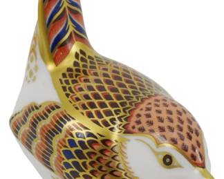 802 - Royal Crown Derby Jenny Wren Paperweight (Description): Royal Crown Derby Jenny Wren paperweight  featuring the classic Imari color palette  with intricate hand-painted decoration in  rich rust, cobalt blue, and 22-carat gold  accents. The charming bird figure displays detailed feather patterns throughout. Fitted  with a silver stopper on the base. Measures 3  inches.
