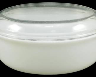 1142 - Pyrex White 1.5 Qt Casserole Dish w/ Lid (Description): Pyrex white opal glass 1 1/2 quart casserole  dish with clear glass lid. This classic  oval-shaped covered casserole features the  iconic milk glass body with tab handles on  each end and a fitted domed lid. Measures 4 inches high by 11 inches long by 7inches  wide.