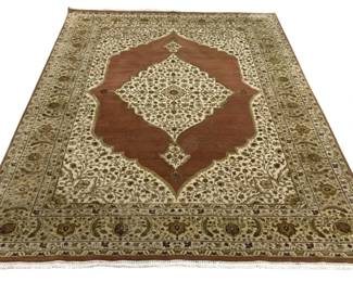 7731 - Persian Silk & Wool Area Rug 98"x125" (Description): A handsome Persian hand knotted area rug  featuring a classic medallion design. The rug  displays a central cream-colored diamond  medallion set against a warm rust/copper  field, surrounded by an ivory border filled with intricate floral and vine motifs.  Multiple decorative borders in olive green  and cream tones frame the piece, with  traditional paisley and botanical patterns  throughout. The rug retains its original