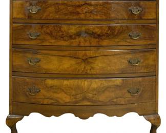 7769 - Antique English Burl Walnut 4 Drawer Chest (Description): Antique burl walnut four drawer chest  featuring a bow front design with beautifully  matched book-matched veneer on each drawer  front. The chest is fitted with brass bail  handles and rests on Queen Anne style cabriole legs with pad feet. A scalloped  apron adds elegant detail to the base.  Measures 33 inches high by 32 inches wide by  18 inches deep.