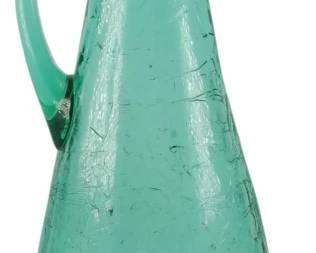 840 - MCM 18" Blenko Crackle Glass Pitcher (Description): Mid Century Blenko crackle glass pitcher vase  in a striking teal or sea green color. This  elegant piece features the distinctive  crackle glass technique Blenko is known for,  with an elongated conical body, graceful applied handle, and dramatic asymmetrical  pointed spout. Measures 18 inches tall.