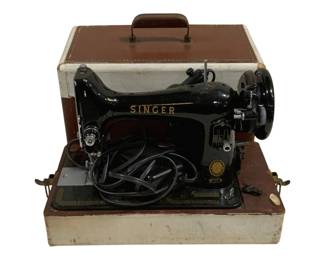 1715 - Singer Sewing Machine Model 99 w/ Case (Description): Singer Sewing Machine Model 99 with original  carrying case. This vintage black electric  sewing machine features gold lettering and  decorative accents. The portable case has a  brown and cream exterior with brass-tone latches and a carrying handle. Complete with  power cord. Measures 15 inches long by 8  inches wide by 14 inches tall. Used as is electric/electronic/mechanical  item. No guarantee all components, untested.