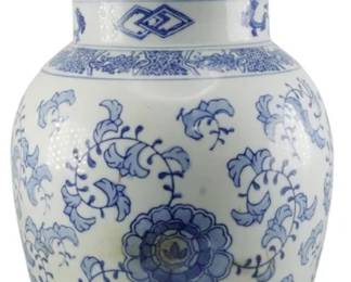 1062 - Blue & White Porcelain 19.5" Ginger Jar (Description): Vintage Oriental porcelain ginger jar  featuring classic blue and white decoration.  The jar displays traditional floral motifs  with peonies and scrolling foliage throughout  the body. The domed lid is topped with a figural bird finial. Measures 19.5 inches in  height.