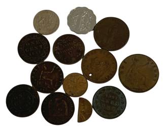 1562 - Lot of Antique Foreign Coins (Description): A lot of antique foreign coins featuring  various denominations and countries of  origin. The collection includes copper and  bronze cents, including what appears to be  Canadian large cents dated 1847, British pennies and half pennies, and other colonial  era coinage. Some coins show significant age  and patina consistent with their antique  status. One coin has been holed, and one  piece is a half coin fragment. The lot