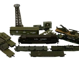 1664 - 8pc Lot Athearn HO Scale Train Cars w/ Boxes (Description): A lot of eight HO scale train cars by  Athearn, presented in their original boxes.  The collection includes various freight cars  featuring Southern Railway and Norfolk and  Western railroad liveries. The Athearn boxes display the classic vintage packaging artwork  depicting locomotives in scenic railway  settings.1663 - 10pc Lot HO Scale Military Trains (Description): A collection of 10 HO scale military trains  and accessories. The lot includes a U.S. Army  diesel locomotive numbered 2800, an ammo car  marked U.S. Army, flatbed cars carrying  military vehicles, a radar tower, a U.S. Army command post building, tanks, and additional  military rolling stock. The pieces are  finished in olive drab and camouflage  military colors appropriate to the U.S. Armed  Forces theme.