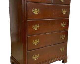 7682 - Statton Chippendale Style 6 Drawer Chest (Description): Chippendale style six drawer chest in cherry  finish featuring two small drawers over four  graduated long drawers. The piece showcases  classic brass bail pulls with decorative back  plates and rests on bracket feet. A molded cornice top completes the traditional design.  Measures 46 inches high by 35 inches wide by  21 inches deep.