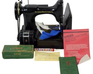 959 - Vintage Singer Featherweight Sewing Machine w/case (Description): Singer sewing machine housed in its original  black carrying case with metal latches and a  top handle. The portable case features twin  locking clasps with keyholes and sturdy  construction for safe transport and storage. Measures11 inches wide by 14 inches long by 8  inches high. Used as is electric/electronic/mechanical  item. No guarantee all components, untested.