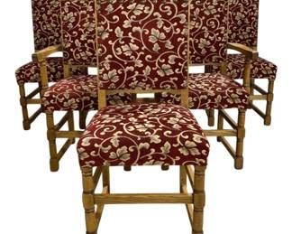 7775 - Set of 6 Carved Oak Dining Chairs 42"x22"x18" (Description): Set of six carved oak dining chairs featuring  upholstered seats and backs in a burgundy  red fabric with cream and green scrolling  leaf pattern. The chairs display turned legs  with stretcher bases and carved decorative crests along the top rail in a traditional  style. Each chair measures 42 inches high by  22 inches wide by 18 inches deep.