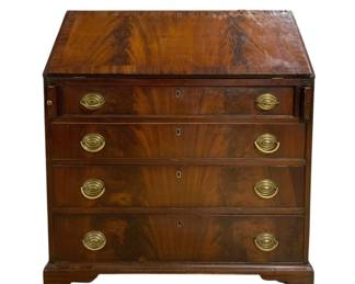 7624 - Antique Mahogany Slant Front Secretary (Description): Antique mahogany slant front secretary desk  featuring beautiful flame mahogany veneer  throughout. The piece has a fall front  writing surface above four graduated drawers,  each fitted with oval brass bail pulls and escutcheons. The desk rests on bracket feet  and displays characteristic Georgian-style  construction. Measures 31 inches wide by 46  inches tall by 18 inches deep. Veneer  buckling & losses on lid.