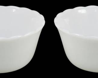 1207 - 2 Fire King Custard Cups 2"x4" (Description): Pair of Fire King custard cups in classic  milk glass white. Each cup features a  scalloped rim and tapered body with a smooth  exterior finish. Measurements: 2 inches tall  by 4 inches in diameter.