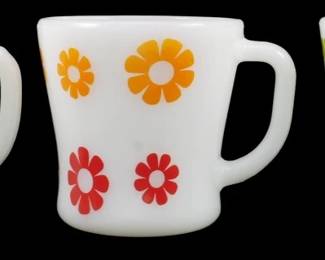 1109 - Set of 3 Vtg Federal Daisy 2 Color Mugs (Description): Set of three vintage Federal Glass daisy  pattern mugs, each featuring a two-color  floral design. The white milk glass mugs  showcase colorful daisy motifs in contrasting  color combinations: one with brown and yellow flowers, one with orange and red  flowers, and one with green and blue flowers.  Classic mid-century American glassware with  the distinctive Federal Glass D-handle  design.