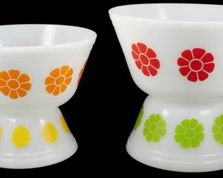 1031 - Vtg Federal 4pc Daisy Bowl Set 4"x8" (Description): Vintage Federal 4-piece Daisy bowl set  featuring white milk glass bowls and bases  decorated with colorful daisy flower motifs.  The set includes two bowl and base  combinations in coordinating colors: one with orange and yellow daisies, and one with red  and green daisies. This cheerful mid-century  pattern is characteristic of Federal Glass  Company's popular kitchenware designs.  Measures 4" x 8".