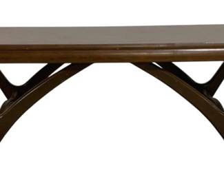 7602 - Mid-Century Modern Sculptural Coffee Table (Description): Mid-century modern coffee table featuring a  rectangular top with rounded edges. The  sculptural base showcases organic, angular  supports with open geometric cutouts,  characteristic of 1960s Danish-inspired design. Measures 15 inches high by 54inches  wide by 20 inches deep.