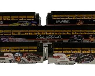 1586 - 5pc Dale Earnhardt HO Scale Train Car Set (Description): Five-piece Dale Earnhardt commemorative train  car set in HO scale. The passenger cars  feature various tributes to the legendary  NASCAR driver, including 'The Legend,' 'The  Intimidator,' 'Seven Time Winston Cup Champion,' and 'The Man in Black' graphics.  Each car displays images of Earnhardt and his  iconic #3 race car in the distinctive black  Goodwrench livery. The cars feature  gold-toned window details throughout.