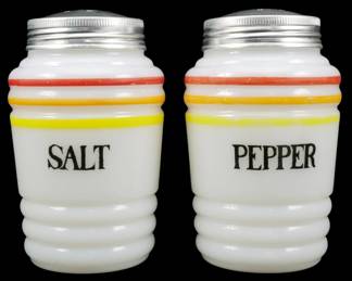 1143 - Hazel Atlas Pr Range Salt & Pepper Shakers (Description): Hazel Atlas pair of range salt and pepper  shakers in white milk glass with ribbed  bases. Each shaker features red, orange,  yellow, and yellow-green horizontal stripes  near the top, with "SALT" and "PEPPER" printed in black lettering on the front.th  have original aluminum screw-on lids.  Measures 4.5" tall.