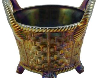720 - Vtg Northwood Carnival Glass Cobalt Basket (Description): Vintage Northwood Carnival Glass cobalt blue  bushel basket featuring a basket weave  pattern with rope-twist rim and handles. The  piece rests on four decorative feet and  displays the characteristic iridescent finish typical of carnival glass. Measures4 1/2" x  5".