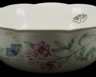 777 - Lenox Butterfly Meadow Bowl 4"x10" (Description): Lenox Butterfly Meadow bowl featuring the  pattern's signature botanical and butterfly  motifs. The white porcelain bowl displays  delicate hand-painted style decoration  including blue and yellow butterflies, purple flowers, and green foliage. The bowl has a  scalloped rim edge. Measures 4 inches tall by  10 inches in diameter.