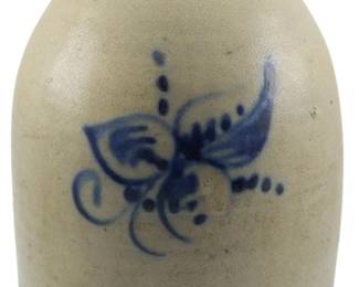 609 - Mid 19th C. West Troy Pottery 2 Gallon Jug (Description): A mid 19th century West Troy Pottery 2 gallon  jug featuring cobalt blue floral decoration.  The stoneware jug bears the impressed West  Troy Pottery maker's mark near the rim.  Measures 12 inches in height.