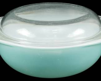 1104 - Vtg Turquoise Pyrex Casserole Dish w/ Lid (Description): Vintage turquoise Pyrex casserole dish with  clear glass lid. The dish features the  classic robin's egg blue color that Pyrex was  known for during the mid-century period. The  domed lid allows for easy viewing of contents while cooking. Measures 4.5 inches  tall by 7 inches wide by 9 inches long.