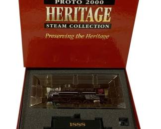 1582 - Proto 2000 USRA Steam Locomotive & Car (Description): Proto 2000 Heritage Steam Collection USRA  steam locomotive and car. This model set  features a detailed steam locomotive with  matching tender numbered 1888. The set comes  in its original red presentation box with protective foam insert and clear display  case. Part of the Proto 2000 'Preserving the  Heritage' series.
