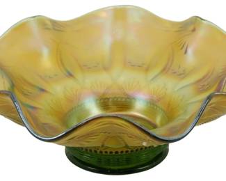 685 - Northwood Green Posies & Pods Carnival Bowl (Description): Vintage Northwood Green Posies and Pods  carnival glass bowl featuring a ruffled  scalloped edge and iridescent finish. The  bowl displays the classic Posies and Pods  pattern with decorative fan motifs radiating from the center. The glass exhibits beautiful  golden amber and green iridescent coloring  with purple and blue highlights at the  center. Measures 3 inches tall by 7 inches in  diameter.