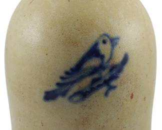 606 - 1800s Boston Stoneware Jug S.W. Clifford (Description): Mid 1800s New England area stoneware jug,  sold by S.W. Clifford of Boston. The crock  features a cobalt blue floral decoration on  the front. Measures 11.5 inches tall.