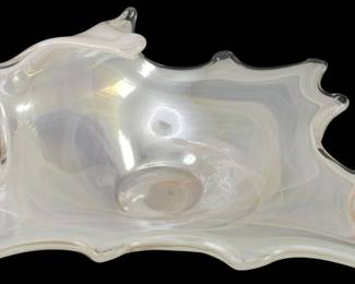 904 - Mid Century Hand Blown Iridescent Bowl (Description): Mid Century hand blown console bowl featuring  an organic freeform shape with an iridescent  opalescent finish. The bowl has an artistic  wavy edge design typical of studio art glass  from this period. Measures 7 inches tall by 12 inches by 12 inches.
