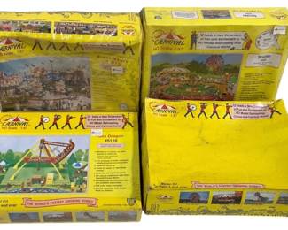 1672 - 4pc Carnival HO Scale 1:87 Model Kits (Description): A collection of four Carnival HO Scale 1:87  model kits designed for model railroading and  carnival world displays. The lot includes  Break Dance, Spider, and Sea Dragon ride  kits, each in original yellow retail boxes featuring colorful carnival imagery. The kits  are marketed as adding a new dimension of  fun and excitement to HO model railroading,  circus, and carnival world scenes. Model kits  are designed for ages 8 and over.