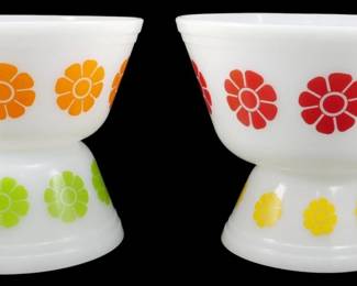 1135 - Vintage Federal 4pc Daisy Bowl Set 4"x8" (Description): Vintage Federal 4-piece Daisy bowl set  featuring white milk glass bowls decorated  with colorful daisy flower motifs. The set  includes bowls in orange, red, green, and  yellow floral patterns, representing the cheerful mid-century modern aesthetic Federal  Glass was known for. Measures 4" x 8".