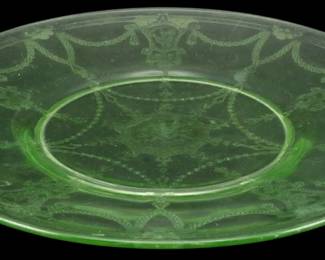 897 - Anchor Hocking Cameo Ballerina Uranium Dish (Description): Vintage Anchor Hocking Cameo Ballerina  uranium glass dish featuring the classic  Depression-era pattern with elegant etched  designs including draped garlands, bows, and  dancing ballerina figures. The green vase line glass displays the characteristic  translucent glow associated with uranium  content. Measures 8 inches in diameter.
