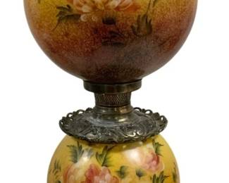 1650 - Gone with the Wind Lamp 30" (Description): Gone with the Wind style lamp featuring a  double globe design with hand-painted floral  motifs. Both the upper and lower glass globes  display pink and cream chrysanthemums  against a yellow to brown ombre background. The lamp sits on an ornate pierced brass base  with scrollwork details, and features a  decorative brass collar between the globes.  Measures 30 inches tall. Used as is electric/electronic/mechanical