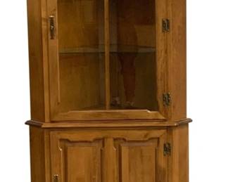 7519 - Corner Cupboard w/ Light - 70 x 34 x 19 (Description): 2pc Design w/ Glass Doors on Top and Paneled  Doors on the Bottom. Used as is  electric/electronic/mechanical item. No  guarantee all components present, untested.