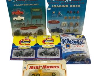 1028 - 6pc Lot Cars & Trucks (Description): A six-piece lot of cars and trucks. The  collection includes various model vehicles in  their original packaging.