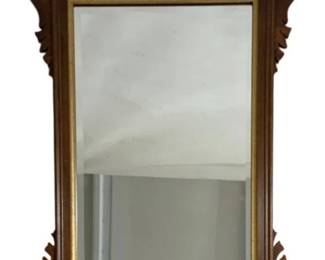 7635 - Chippendale Style Burlwood Wall Mirror (Description): Featuring a beautifully figured burlwood  frame with ornate scrolling acanthus leaf  carvings. The rectangular beveled glass is  set within a gilt inner border. A decorative  brass eagle ornament adorns the left side of the frame, it is marked on back CHC - E1583 .  Measures 37 inches wide by 20 inches tall.