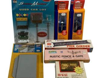 1045 - Assorted Decorative HO Scale Train (Description): A lot of seven assorted decorative train  items. The collection includes various HO  scale accessories suitable for model railroad  layouts and dioramas.
