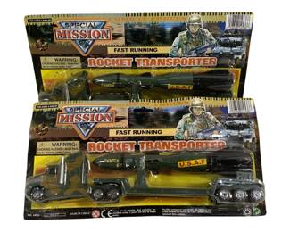 1633 - 2pc Special Mission Military Playsets Lot (Description): Two-piece lot of Special Mission military  playsets featuring Rocket Transporter  vehicles. Each set includes a military truck  cab with flatbed trailer carrying a U.S.A.F.  rocket missile. The toys are in their original packaging, marked as suitable for  ages 3 and up. Made in China.