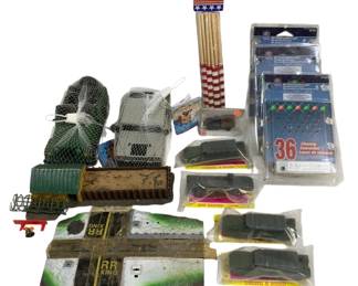 1659 - Lot Vtg Toys Model Train Accessories & More (Description): A varied lot of vintage toys and collectibles  including model train accessories featuring  RR King railroad crossing signs and scenery  pieces, a green model train car, packaged  micro miniature military vehicles, holiday string lights in original packaging, one  dozen parade flags with wooden sticks, netted  toy vehicles, and additional miscellaneous  items. An eclectic assortment suitable for  collectors and hobbyists.