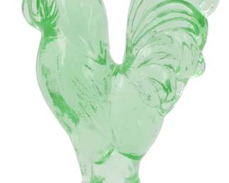 1050 - Green Glass Rooster Figure 4.5" (Description): Green glass rooster figure featuring a proud  standing pose with detailed feathered tail  and comb. The translucent green glass has a  luminous quality typical of decorative  pressed glass pieces. Measures 4.5 inches tall.