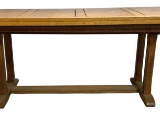 7774 - English Oak Trestle Dining Table 31"x72"x30" (Description): Oak trestle dining table featuring a warm  medium finish with visible wood grain  throughout. The rectangular top displays  decorative paneling with inlaid banding  details. The table is supported by a substantial trestle base with two vertical  supports connected by a horizontal stretcher,  resting on broad feet. Measures 31 inches  high by 72 inches long by 30 inches deep.