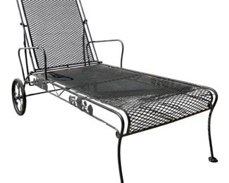 7691 - Black Metal Mesh Outdoor Lounge Chair (Description): Metal outdoor lounge chair featuring expanded  metal mesh construction throughout the seat  and adjustable back. The chair includes  curved armrests and decorative scrollwork  detail at the top of the backrest. Supported on sturdy legs with protective foot caps.  Measures 44" x 63" x 29".