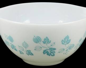 1187 - Pyrex Turquoise Gooseberry Small Mixing Bowl (Description): Pyrex turquoise Gooseberry pattern small  mixing bowl in white milk glass. The bowl  features the classic Cinderella style with  pour spouts and tab handles on either side.  Decorated with a charming turquoise print of gooseberries and leaves around theexterior.  Measures 3.5 inches tall by 7 inches wide by  6 inches deep.