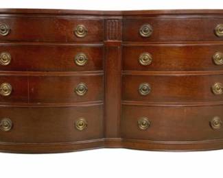 7683 - Mahogany Bow Front Dresser w/ Glass Top (Description): Eight drawer dresser with glass top in a rich  mahogany finish. This handsome piece  features a double bow front design with four  drawers on each side, accented by brass ring  pulls. The dresser showcases Federal-style details including fluted pilaster columns at  the corners and carved rosette medallions.  The piece rests on tapered legs with spade  feet. Measures 34 inches high by 56 inches  wide by 21 inches deep.
